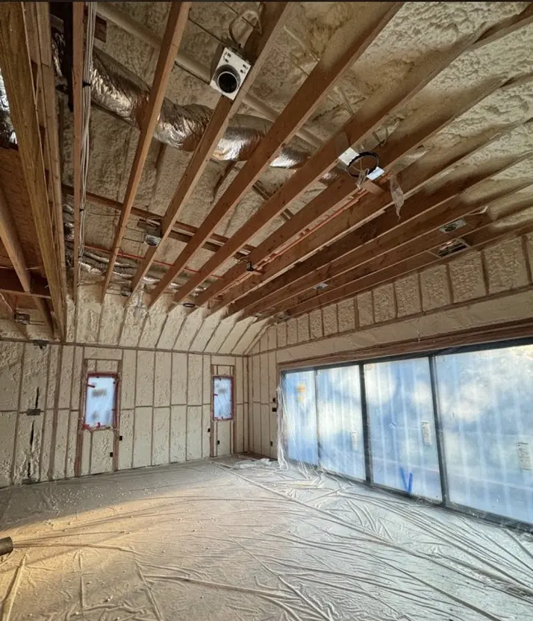 Interior walls and ceiling insulated with spray foam during new construction in Marlboro Village